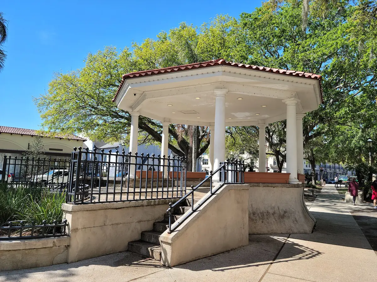 The white gazebo in the Plaza de la Constitución under oaks, a stop on St. Augustine carriage tours
